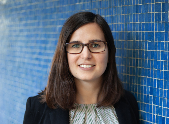 Portrait of Franziska in front of a blue wall