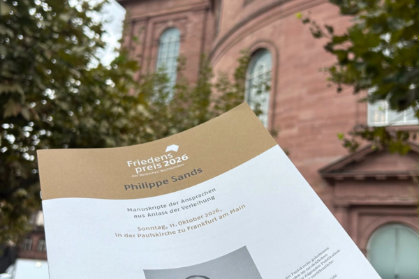 A paper programm of the peace prize ceremony is held in front of the Frankfurt Paulskirche.